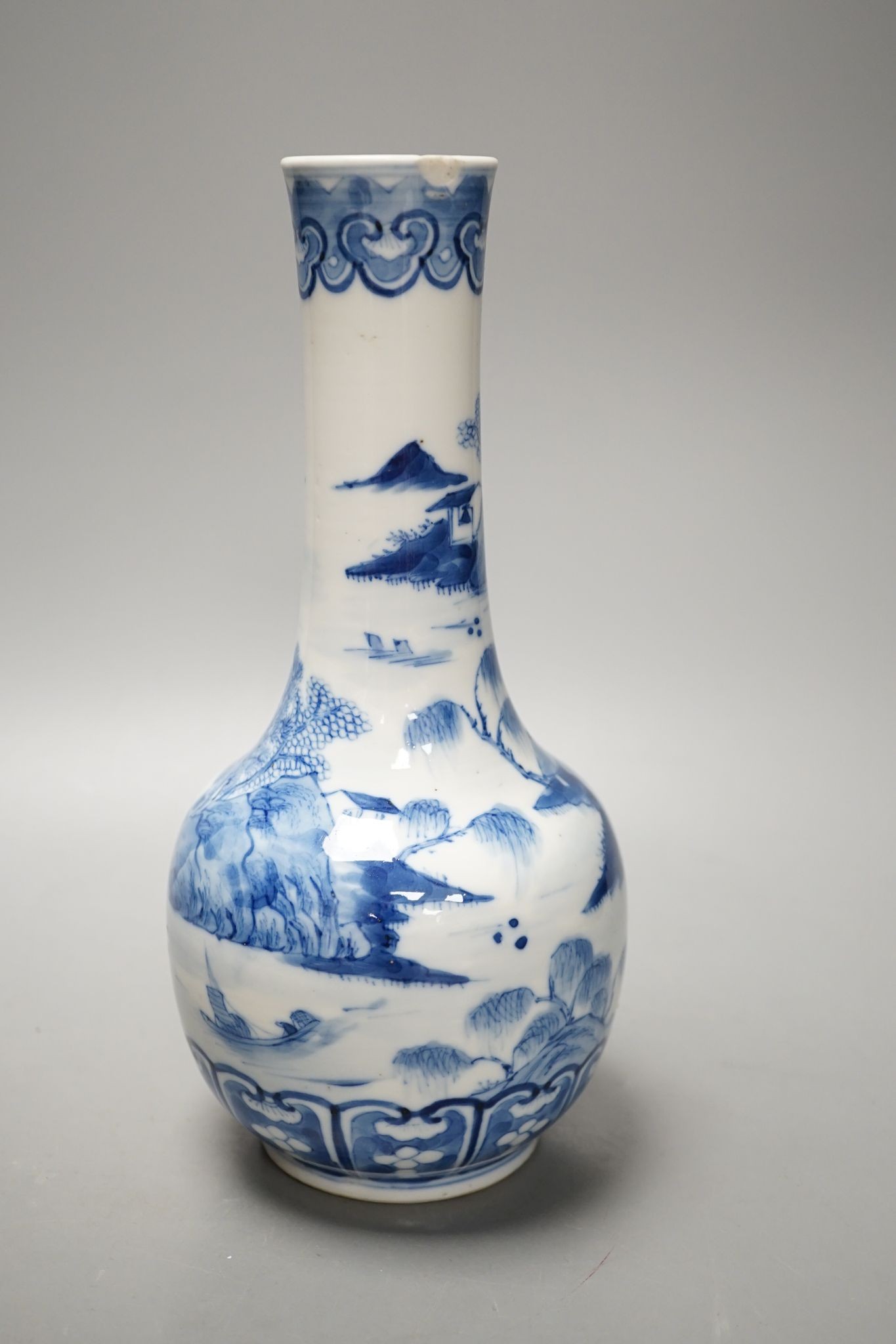 A Chinese blue and white bottle vase, Kangxi mark but 19th century. 25cm